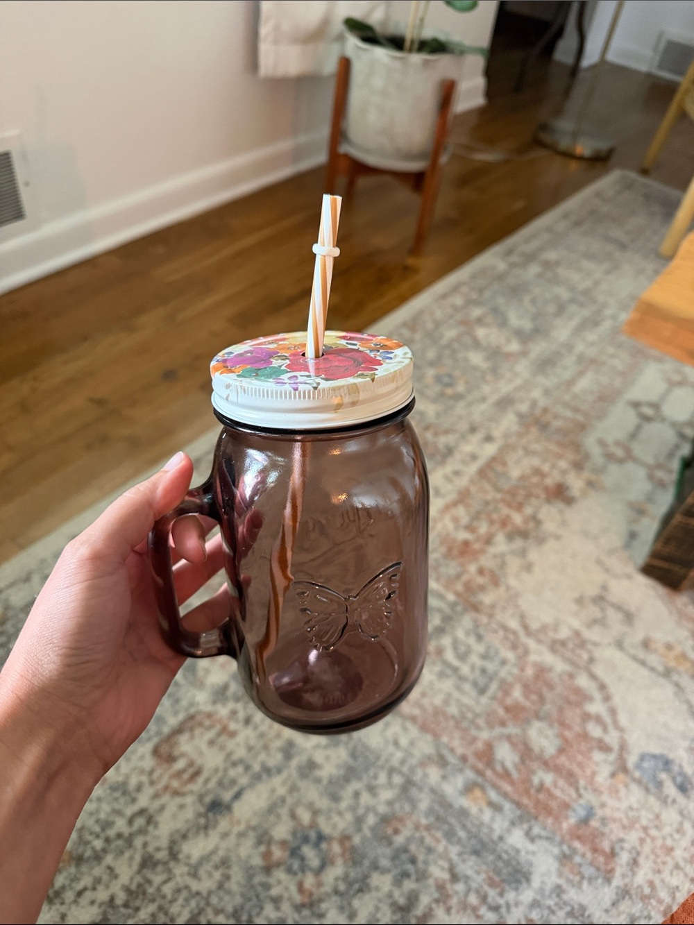 Brown Glass Mason-Style Drinking Jar with Handle and Floral Lid